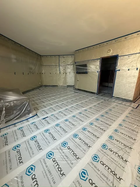 Room surfaces covered before ceiling finishing.